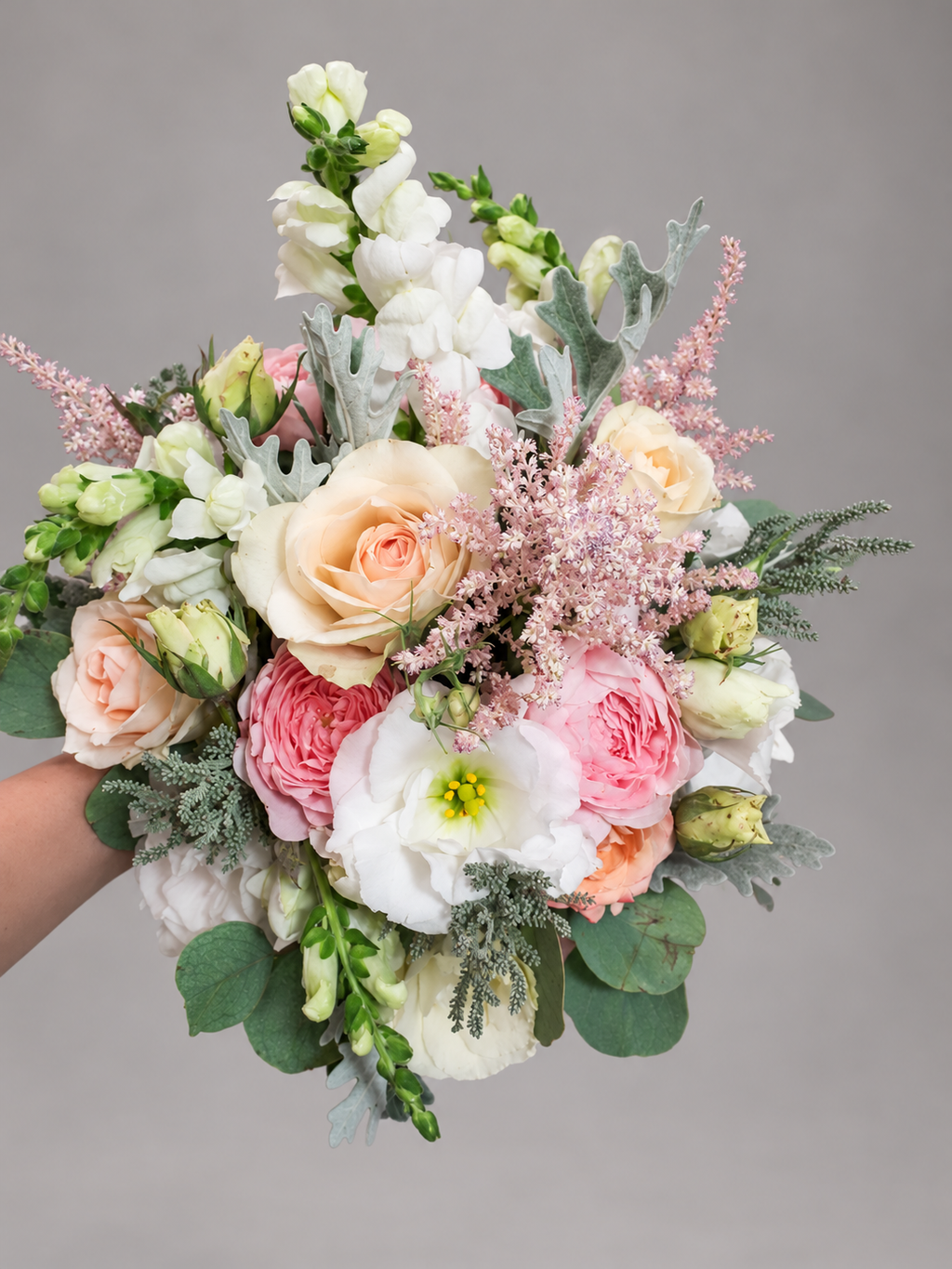 Blush and ivory bridal bouquet with roses, pink astilbe and silver foliage, view 4