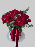 Classic red rose bouquet with fresh red roses, eucalyptus, and decorative fillers by Golden Lotus Bliss in Folsom California