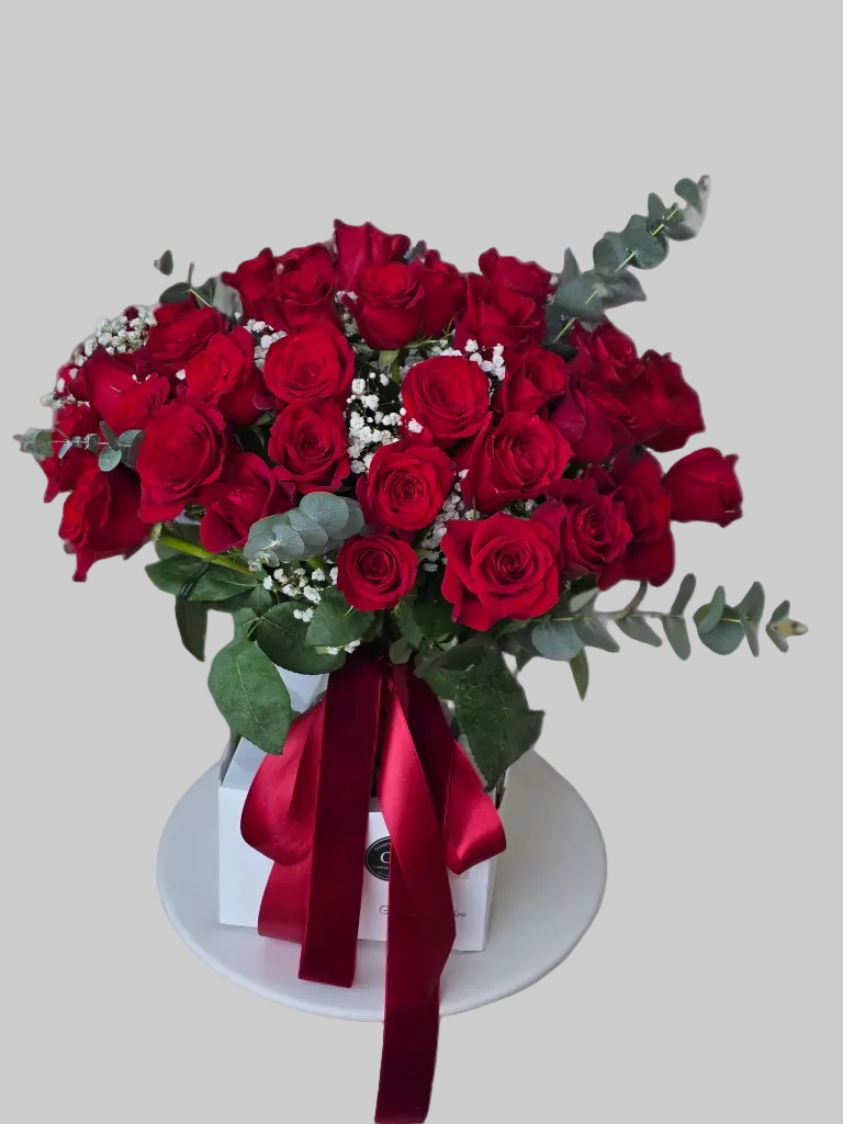 Classic red rose bouquet with fresh red roses, eucalyptus, and decorative fillers by Golden Lotus Bliss in Folsom California