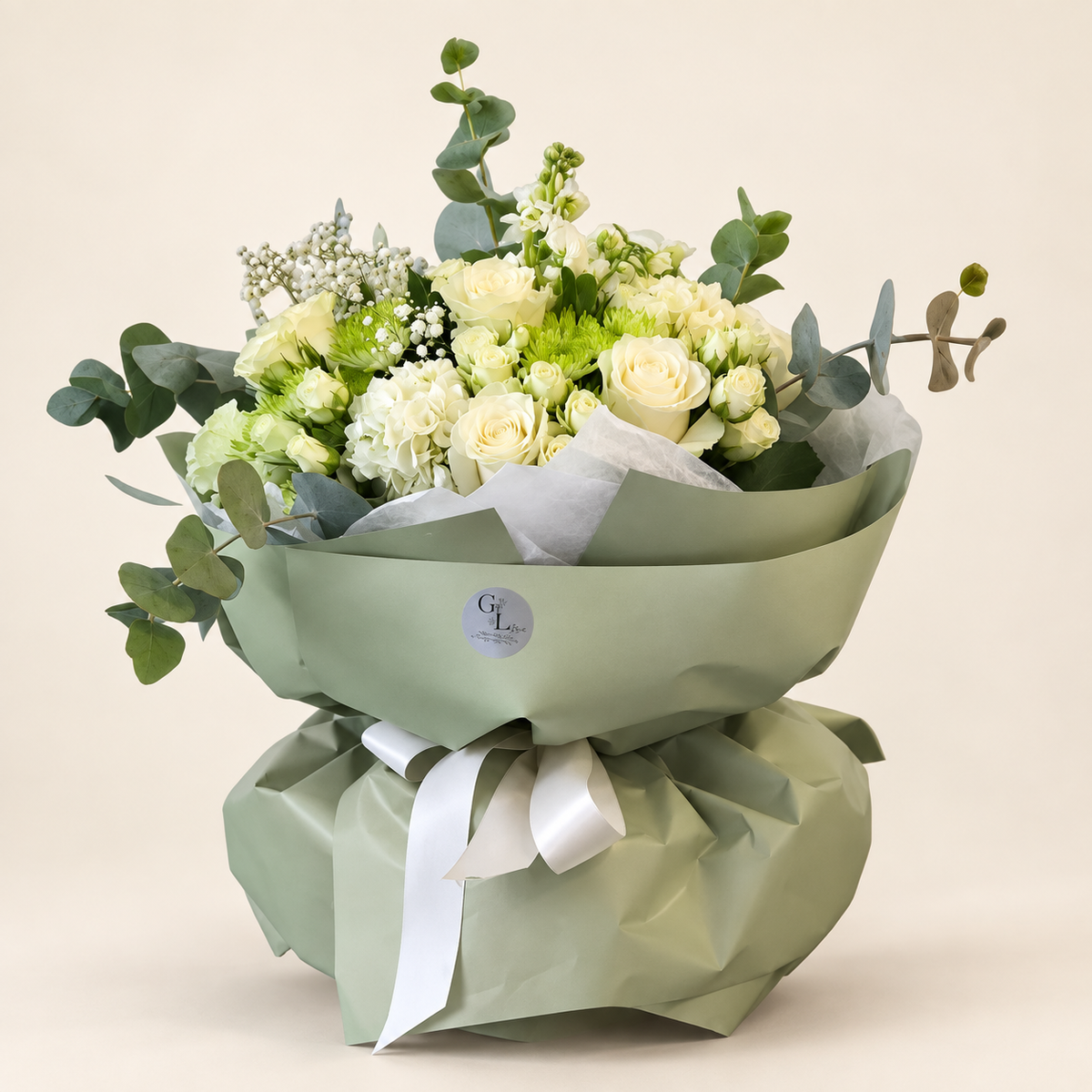 Elegant ivory rose and hydrangea bouquet in sage wrapping by Golden Lotus Bliss