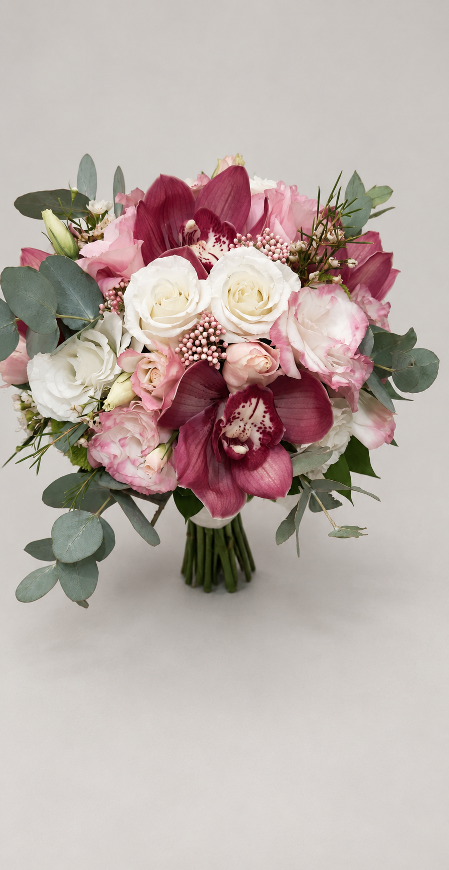 Orchid Romance bridal bouquet with burgundy orchids, blush and white flowers, and eucalyptus