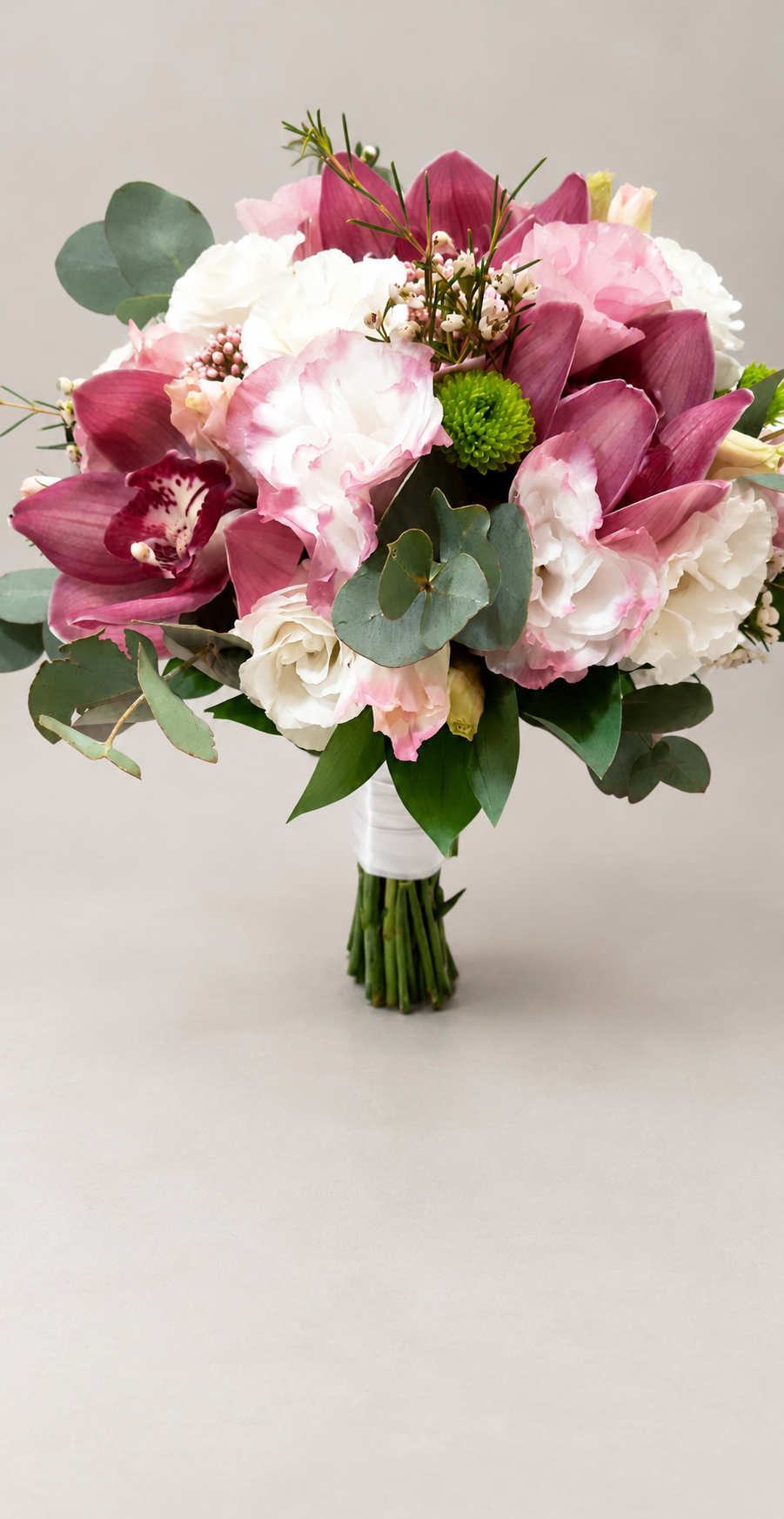 Orchid Romance bridal bouquet with burgundy orchids, blush and white flowers, and eucalyptus