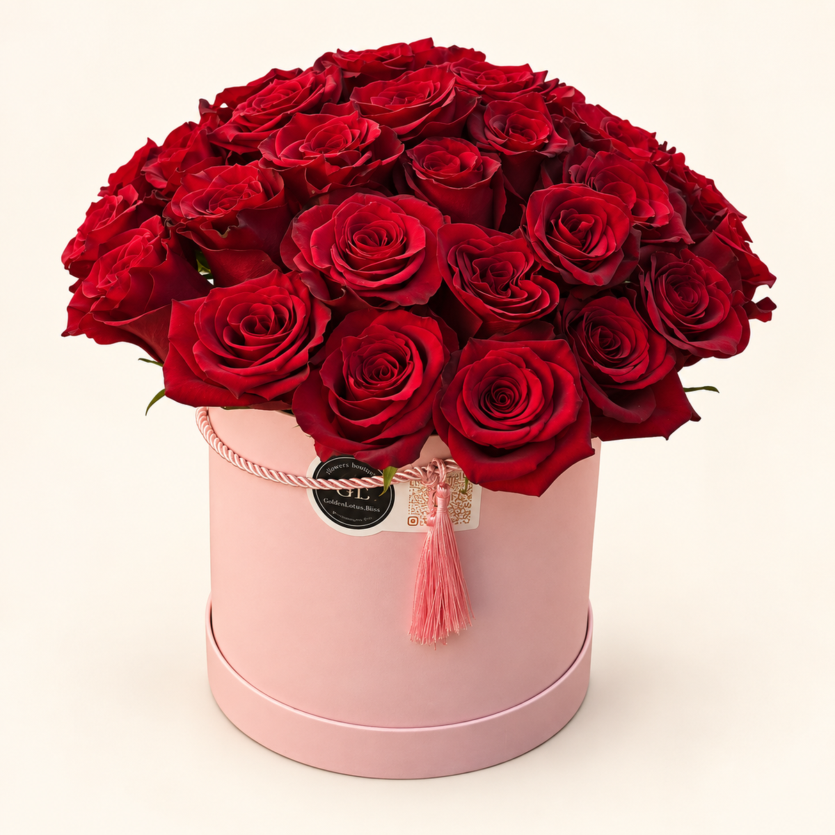 Luxury red roses in a pink flower box by Golden Lotus Bliss