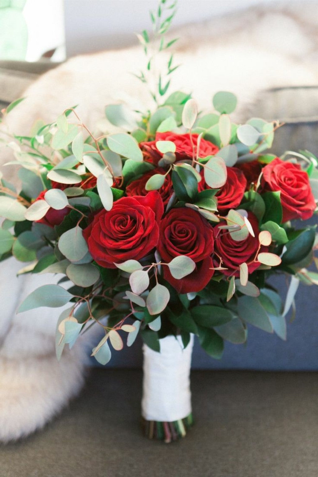 Hand-tied red rose and eucalyptus wedding bouquet